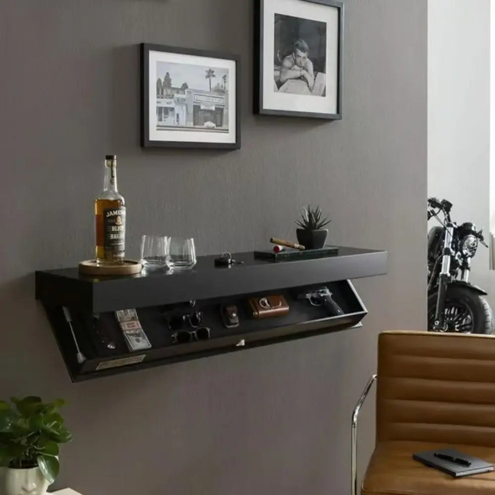 Wall-mounted shelf with decorative items in a room with a brown chair and framed pictures on the wall.